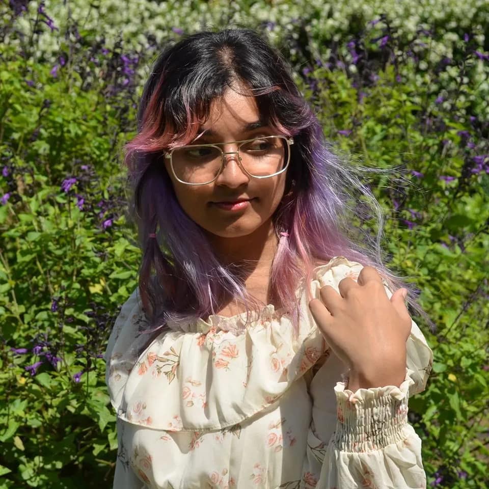 Kuvera wearing glasses